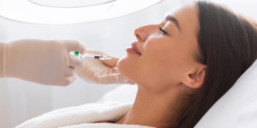 Cosmetologist,Applying,Beauty,Injection,To,Chin,Of,Young,Woman,During Maximizing the Effects of Botox With Proper Aftercare